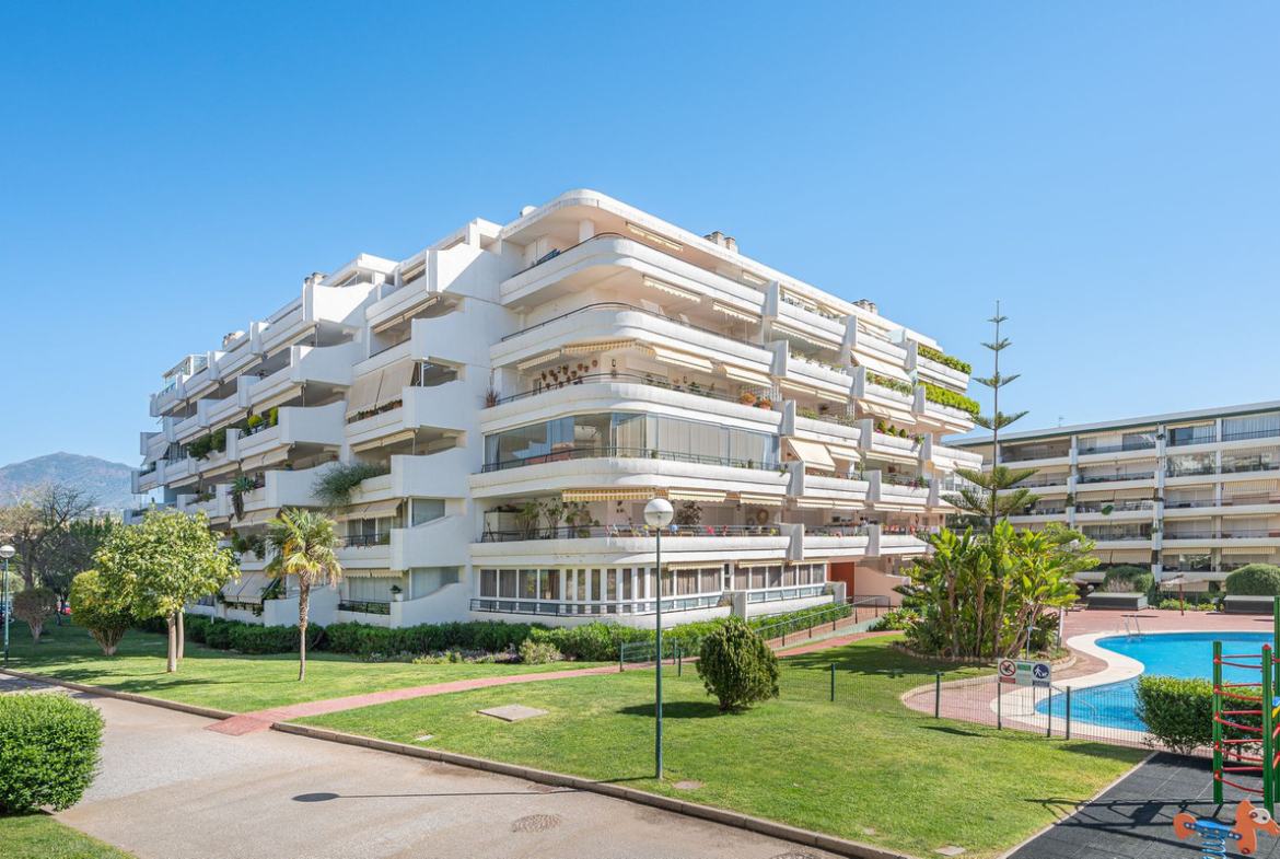 Luxurious Guadalmina apartment with sea views, terraces, and modern amenities.