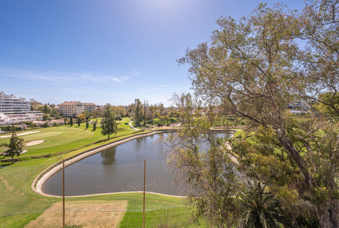 Luxurious Guadalmina apartment with sea views, terraces, and modern amenities.