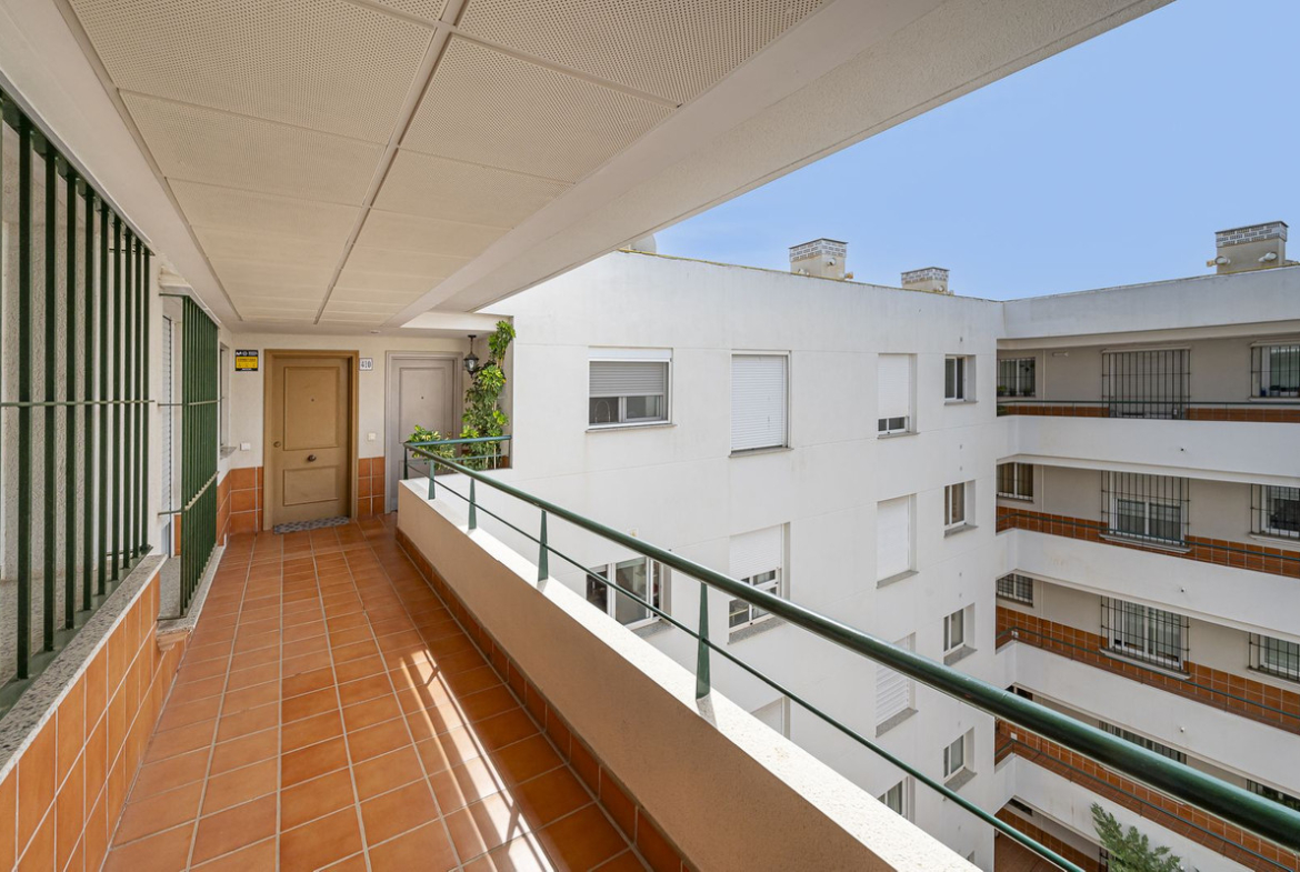 Luxurious Guadalmina apartment with sea views, terraces, and modern amenities.