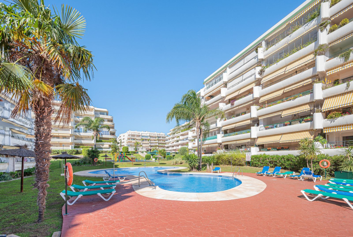 Luxurious Guadalmina apartment with sea views, terraces, and modern amenities.