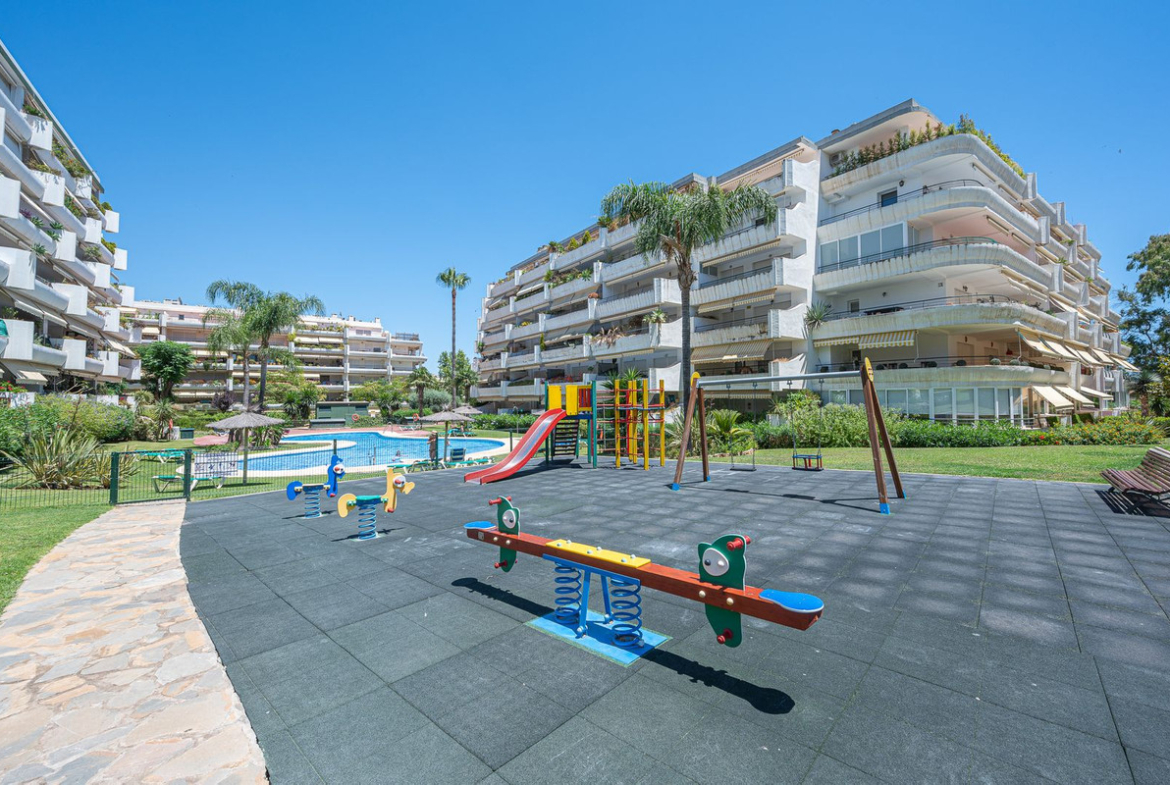 Luxurious Guadalmina apartment with sea views, terraces, and modern amenities.